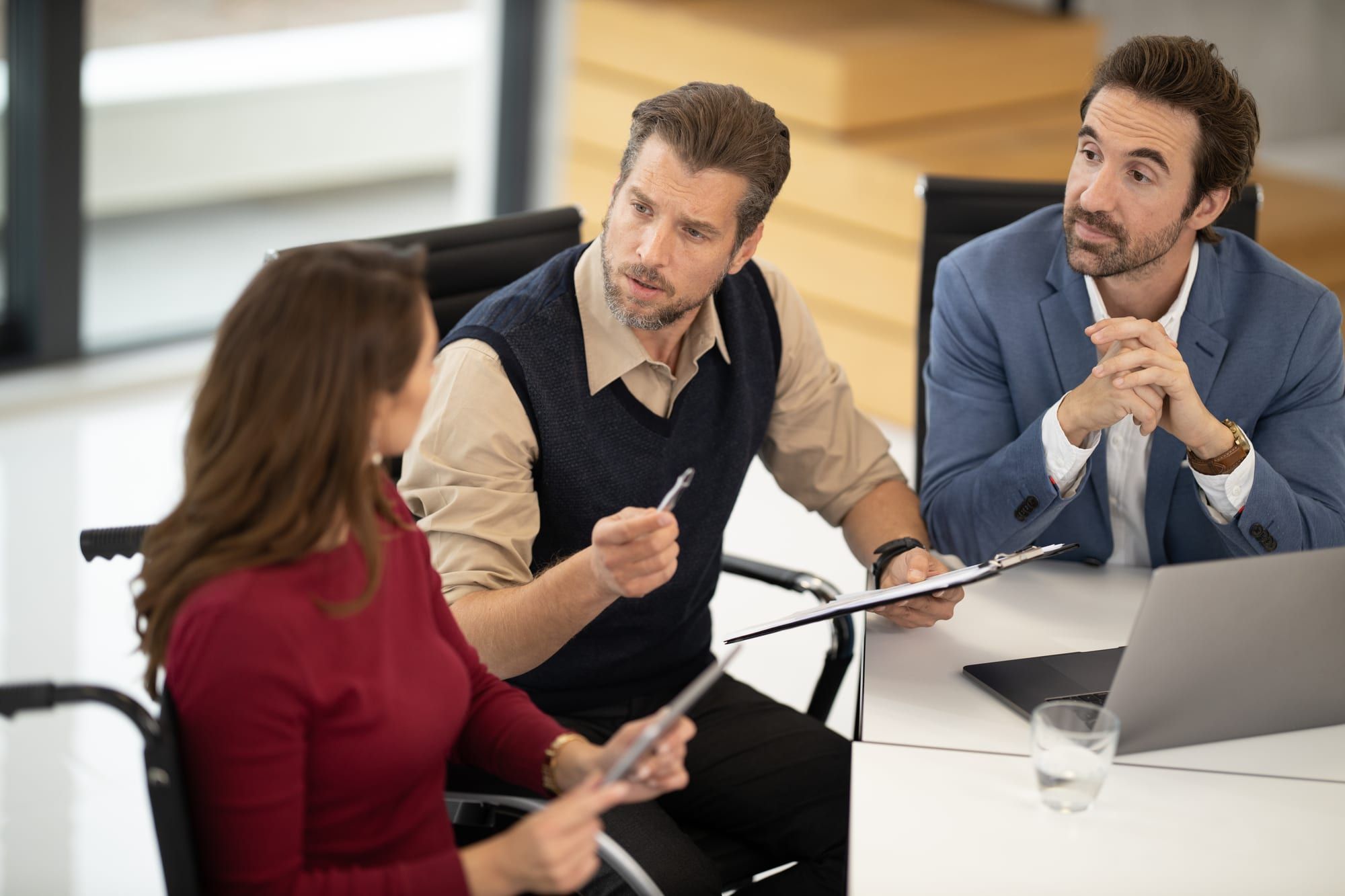 A candidate facing two interviewers across a desk